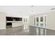 Open concept kitchen with island, dark cabinets, and stainless steel appliances at 8441 Chilton Dr, Orlando, FL 32836