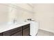 Laundry room with sink, cabinets, washer, and dryer at 8441 Chilton Dr, Orlando, FL 32836
