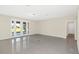 Spacious living room with tile floors and access to backyard patio at 8441 Chilton Dr, Orlando, FL 32836