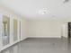 Living area with tile floors and French doors leading to the outdoors at 8441 Chilton Dr, Orlando, FL 32836