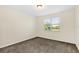 Bright bedroom with neutral carpeting at 8441 Chilton Dr, Orlando, FL 32836