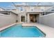 Private screened pool with patio furniture and house view at 8987 Cabot Cliffs Dr, Davenport, FL 33896