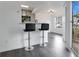 Breakfast bar with two black barstools in a condo living area at 1037 S Hiawassee Rd # 2815, Orlando, FL 32835