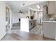 Open concept kitchen with gray cabinets and breakfast bar at 1037 S Hiawassee Rd # 2815, Orlando, FL 32835