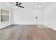 Living room with neutral walls, wood-look floors, and ceiling fan at 1037 S Hiawassee Rd # 2815, Orlando, FL 32835