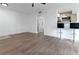 Bright and airy living room featuring wood-look floors and neutral walls at 1037 S Hiawassee Rd # 2815, Orlando, FL 32835
