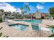 Inviting pool and spa area with lounge chairs and patio tables at 1037 S Hiawassee Rd # 2815, Orlando, FL 32835