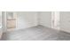 Spacious bedroom with grey carpet and an ensuite bathroom at 1408 Fan Palm Dr, Davenport, FL 33897