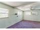 Spacious bedroom with purple carpet and multiple windows at 1716 Sprucewood Ln, Orlando, FL 32818