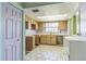 Needs updating, features wood cabinets and tiled floors at 1716 Sprucewood Ln, Orlando, FL 32818