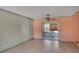 Living room with tiled floor and sliding glass doors to the outside at 1716 Sprucewood Ln, Orlando, FL 32818