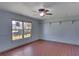 Simple living room with tile flooring, ceiling fan, and large window at 1716 Sprucewood Ln, Orlando, FL 32818