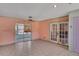 Living area with tiled floors and French doors at 1716 Sprucewood Ln, Orlando, FL 32818