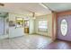 Spacious living area with tiled floors and a view into the kitchen at 1716 Sprucewood Ln, Orlando, FL 32818