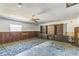 Large office or den with built-in shelving and wood paneling at 1716 Sprucewood Ln, Orlando, FL 32818