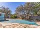 In-ground pool with a safety cover and a large backyard at 1716 Sprucewood Ln, Orlando, FL 32818