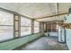 Bright sunroom with multiple windows and view of backyard at 1716 Sprucewood Ln, Orlando, FL 32818