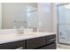 Bathroom with dark vanity, white countertop and shower at 172 Villa Domani Cir, Davenport, FL 33896