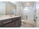 Bathroom with dark vanity, white countertop and tub at 172 Villa Domani Cir, Davenport, FL 33896