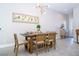 Bright dining area with wood table and seating for six at 172 Villa Domani Cir, Davenport, FL 33896