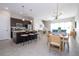 Open concept kitchen with stainless steel appliances and island at 172 Villa Domani Cir, Davenport, FL 33896