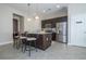 Modern kitchen with dark cabinetry and a large island at 172 Villa Domani Cir, Davenport, FL 33896