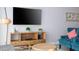Living room with large TV, comfortable seating, and stylish decor at 172 Villa Domani Cir, Davenport, FL 33896