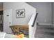 Upstairs landing features a desk and chair, next to the stairs at 172 Villa Domani Cir, Davenport, FL 33896