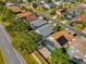 Aerial view of residential neighborhood with houses and solar panels at 2238 Wyndam Way, Kissimmee, FL 34743