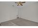 Spacious bedroom with ceiling fan and access to hallway at 2238 Wyndam Way, Kissimmee, FL 34743