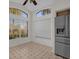 Eat-in kitchen with ample natural light and stainless steel appliances at 2238 Wyndam Way, Kissimmee, FL 34743