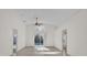 Bright living room with tile floors, vaulted ceiling and sliding doors to the pool at 2238 Wyndam Way, Kissimmee, FL 34743