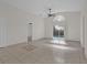 Living room with tile floors, vaulted ceiling and kitchen view at 2238 Wyndam Way, Kissimmee, FL 34743