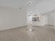 Living room with tile floors and a view into the kitchen at 2238 Wyndam Way, Kissimmee, FL 34743