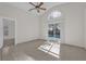 Bright living room with tile floors, vaulted ceiling and sliding doors to the pool at 2238 Wyndam Way, Kissimmee, FL 34743
