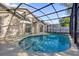 View of kidney shaped pool and house from the backyard at 2238 Wyndam Way, Kissimmee, FL 34743