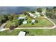 Aerial view of a large waterfront property with multiple buildings and a spacious lot at 2555 Gabriel Rd, Fort Meade, FL 33841