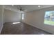 Spacious bedroom with wood-look tile flooring and plenty of natural light at 2683 Hinoki Cypress Pl, Sanford, FL 32773