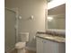 Bathroom features granite vanity and a walk-in shower at 3332 Robert Trent Jones Dr # 10603, Orlando, FL 32835