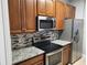 Stainless steel appliances and ample cabinetry in this kitchen at 3332 Robert Trent Jones Dr # 10603, Orlando, FL 32835