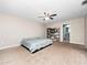 Spacious bedroom with plush carpeting and ceiling fan at 4851 Foxrun Cir, Lakeland, FL 33813