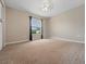 Well-lit bedroom with neutral walls and carpeted floors at 4851 Foxrun Cir, Lakeland, FL 33813