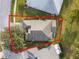 Aerial view of a single-Gathering home with a gray roof in a residential neighborhood at 8019 Arcadian Ct, Mount Dora, FL 32757