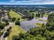 Community landscape with golf course and lake views at 8019 Arcadian Ct, Mount Dora, FL 32757