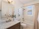 Updated bathroom with a soaking tub, marble vanity, and stylish fixtures at 8019 Arcadian Ct, Mount Dora, FL 32757