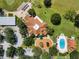 Aerial view of community clubhouse, pool, and parking at 8019 Arcadian Ct, Mount Dora, FL 32757