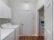 Laundry room with washer, dryer, shelving, and extra storage at 8019 Arcadian Ct, Mount Dora, FL 32757
