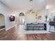Open floor plan living area with hardwood floors and a modern console table at 8019 Arcadian Ct, Mount Dora, FL 32757