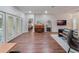 Spacious living room with hardwood floors and access to backyard at 8019 Arcadian Ct, Mount Dora, FL 32757