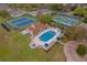 Resort-style pool, spa, and tennis courts in community at 8019 Arcadian Ct, Mount Dora, FL 32757